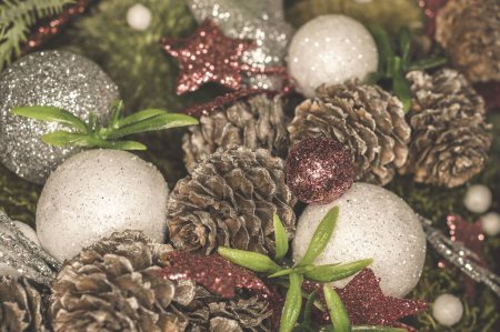 Photo for A closeup shot of pinecones and sparkly ornaments on a Christmas tree - Royalty Free Image