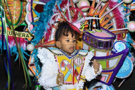 Photo for A kid in a traditional costume during a Junkanoo parade in the Bahamas. - Royalty Free Image