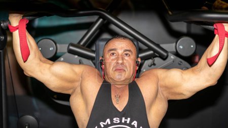Photo for A Caucasian muscular man training at the gym. - Royalty Free Image
