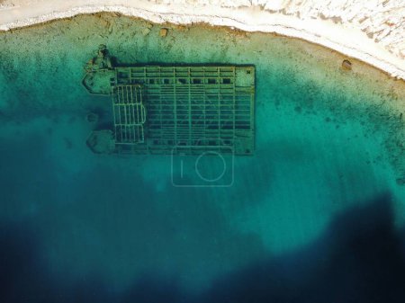 Photo for An aerial top view of the coast of Zavratnica Bay and a shipwreck underwater - Royalty Free Image
