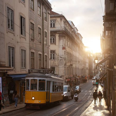 Photo for A tram in downtown Lisbon surrounded by buildings - Royalty Free Image