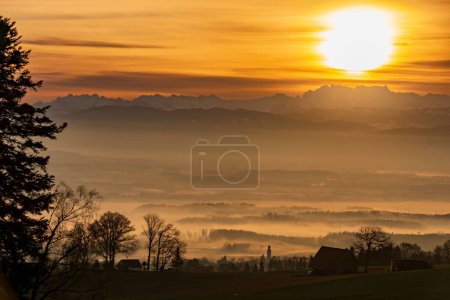 Photo for A stunning golden sunset over a rural area - Royalty Free Image