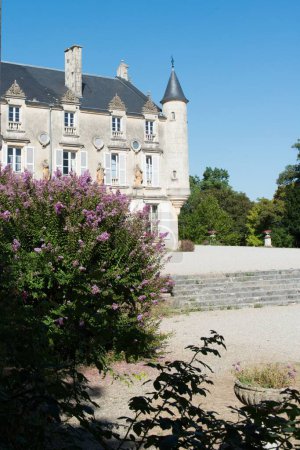 Photo for A vertical shot of the historic Terre Neuve castle and its gardens in Fontenay, France - Royalty Free Image