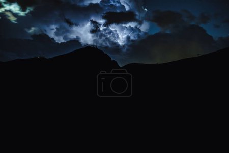 Photo for A dramatic view of a thunderstorm in the Dolomites, Italy, at night - Royalty Free Image