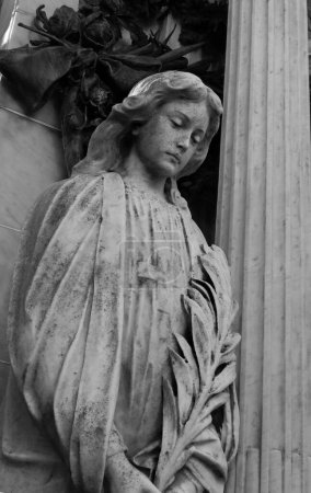 Photo for A vertical grayscale shot of a sculpture in the Recoleta Cemetery, Buenos Aires, Argentina - Royalty Free Image