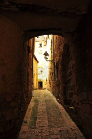 Photo for A vertical shot of an empty narrow footpath with old buildings. - Royalty Free Image