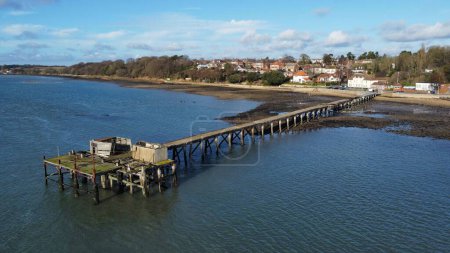 Photo for A drone shot of a wooden dock near the shore of a sea - Royalty Free Image