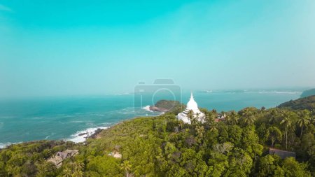 Photo for An aerial shot over the Rumassala Sanctuary near a jungle beach - Royalty Free Image