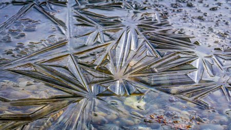 Photo for A closeup shot of a frozen water with beautiful ice crystals - Royalty Free Image