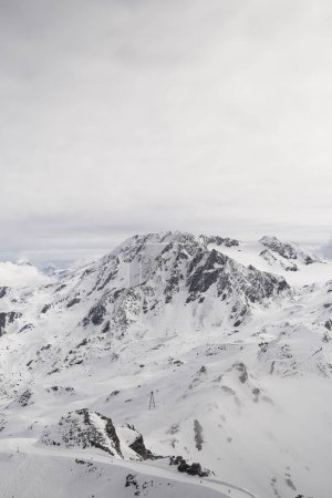 Photo for A breathtaking view of a snowy mountain in Val Thorens in the French Alps, on a cloudy day - Royalty Free Image