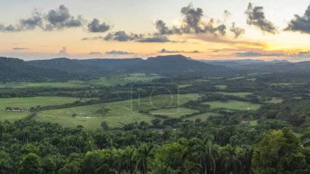Photo for A bird's eye view of fields and forests during a sunset in Cuba - Royalty Free Image