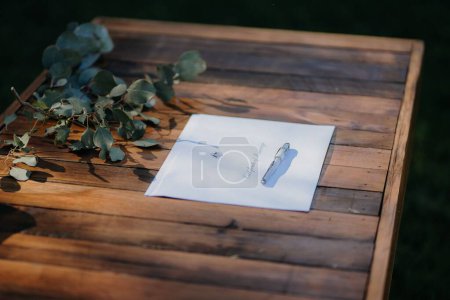 Photo for A selective of a paper with a pen on a wooden table - Royalty Free Image