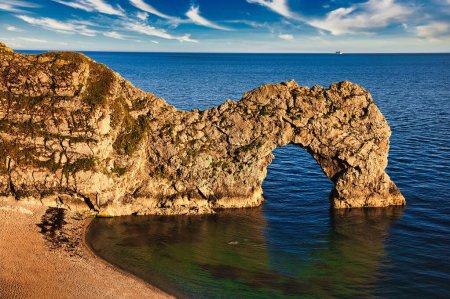 Photo for Scenic view of the Durdle Gate, a natural limestone arch on the Jurassic Coast, England - Royalty Free Image