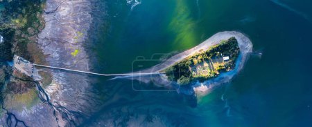 Photo for An aerial shot of the Aucar Island connecting with land with a wooden walkway - Royalty Free Image