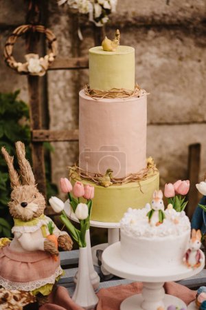 Photo for A vertical shot of the Easter cakes and bunny decorations - Royalty Free Image