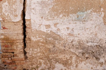 Photo for A old wall with large crack and peeling plaster - Royalty Free Image