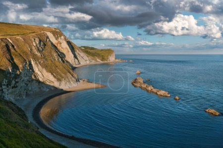 Photo for Charming view of Lulworth Cove on the Jurassic Coast in Dorset on a cloudy day, Southern England - Royalty Free Image