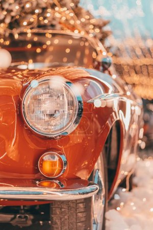 Photo for A vertical closeup shot of a vintage Volvo decorated with Christmas lights - Royalty Free Image