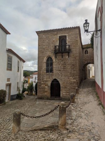 Photo for A street surrounded by stony buildings in Obidos - Royalty Free Image
