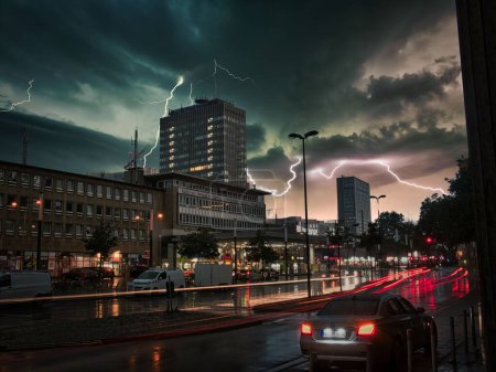 Photo for A street view at night of Thunder over Bahnhof Central station in Essen, Germany - Royalty Free Image