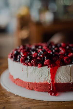 Photo for A close-up of a fresh berry cheesecake with blueberries, currants, and blackberries - Royalty Free Image