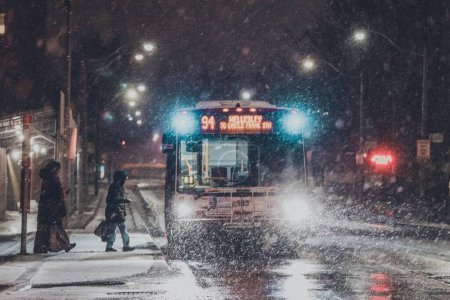 Photo for A scenic view of bus number "94" at a bus station on a snowy evening in Toronto, Canada - Royalty Free Image
