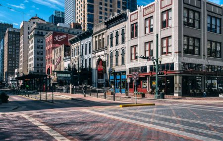 Photo for Houston, TX - March 06, 2020: View of retro style buildings, the Kiam, Deans Credit Clothing, and Clarks on Main Street in Houston Texas. - Royalty Free Image