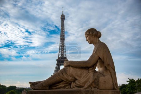 Photo for A statue of a woman in Trocadero Gardens with the Eiffel Tower in the background in Paris, France - Royalty Free Image