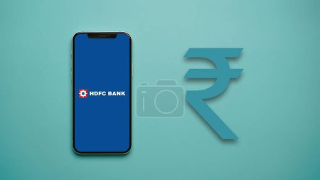 Photo for HDFC Bank on the mobile phone screen, also known as Housing Development Finance Corporation Limited - Royalty Free Image