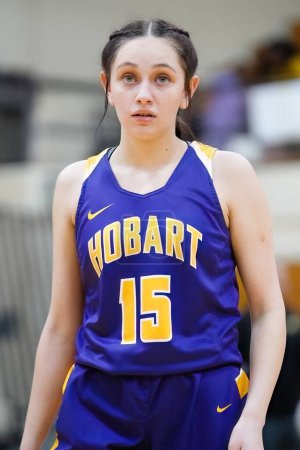 Photo for A vertical shot of a girl playing basketball during the girls fall high school tournament in Australia - Royalty Free Image
