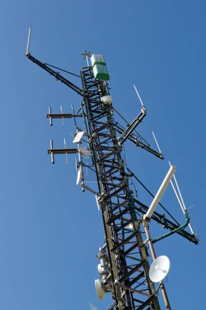 Photo for A low angle view of a cellphone tower in Denia, Spain - Royalty Free Image