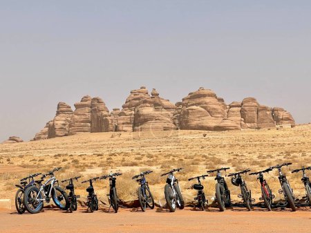 Photo for Several bikes with ruined rocky mountains in the desert of Al Ula, Saudi Arabia - Royalty Free Image