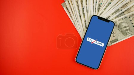 Photo for Yes Bank on a mobile phone screen, isolated color background - Royalty Free Image