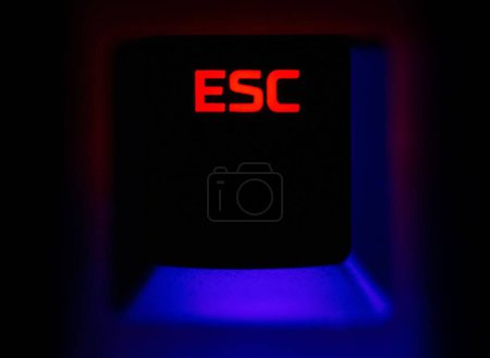 Photo for A computer keyboard with the word esc illuminated on it - Royalty Free Image
