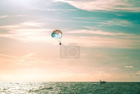 Photo for People parasailing at sunset in Clearwater Beach Florida - Royalty Free Image