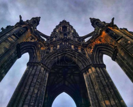 Photo for A low-angle shot of the Scott Monument under the cloudy sky in Edinburg, Scotland - Royalty Free Image