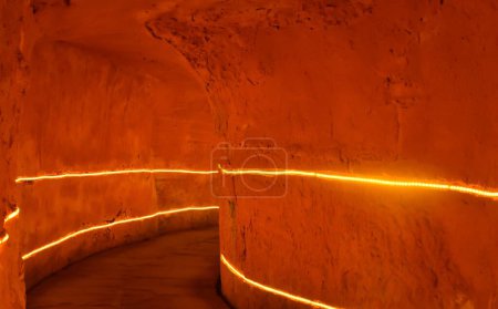 Photo for A tunnel cave with rows of neon lighting on the walls - Royalty Free Image