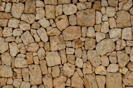 Photo for A stone wall texture background in Spain, Provinze of Valencia, City of Denia - Royalty Free Image
