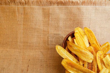 Photo for A top view of the crispy yellow banana chips - Royalty Free Image