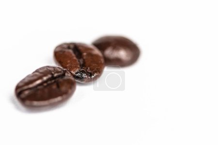 Photo for A closeup shot of coffee beans isolated on a white background - Royalty Free Image