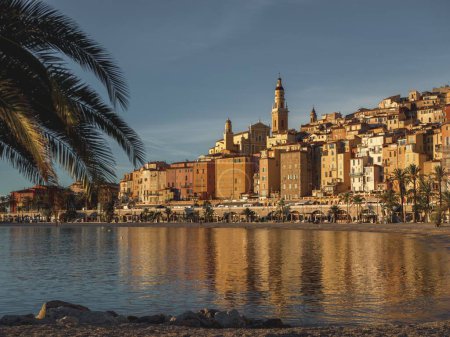 Photo for A beautiful view of the sun rising the small old town of Menton on the French Riviera in southeast France - Royalty Free Image