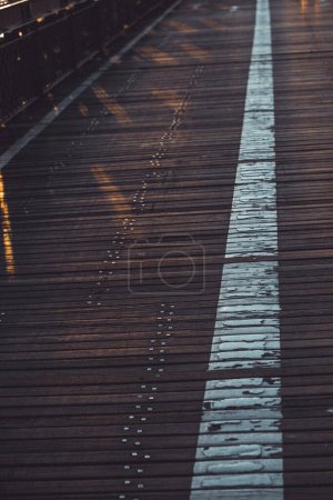 Photo for A vertical shot of the wooden sidewalk of the Brooklyn Bridge - Royalty Free Image