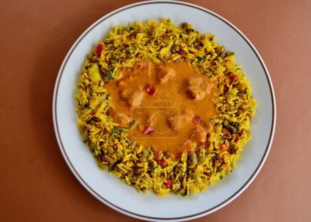 Photo for Delicious butter chicken with basmati saffron rice and lentils - Royalty Free Image