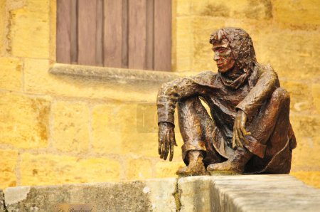 Photo for The bronze statue "The onlooker" by Gerard Auliac in Sarlat, France - Royalty Free Image