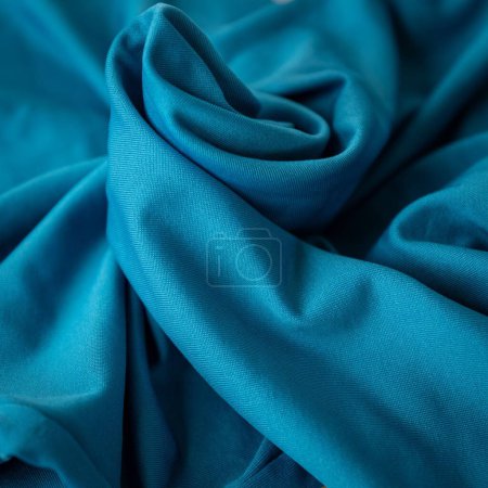Photo for A blue shiny thick fabric photographed with wavy pattern - Royalty Free Image