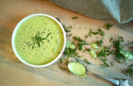 Photo for A closeup of delicious homemade green creamy sauce with dill. - Royalty Free Image