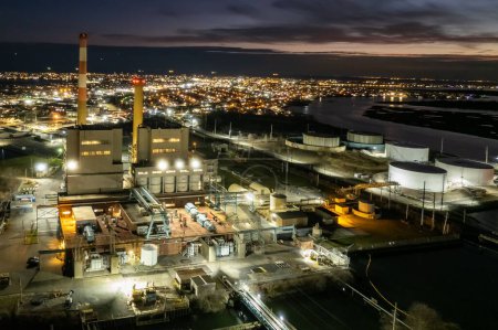 Photo for A drone shot of an industrial power plant at night on Island Park in New York - Royalty Free Image