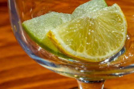 Photo for An apple and lemon slice in glass goblet - Royalty Free Image