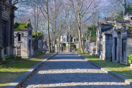 Photo for Paris, the Pere-Lachaise cemetery, cobbled alley with graves in winter - Royalty Free Image