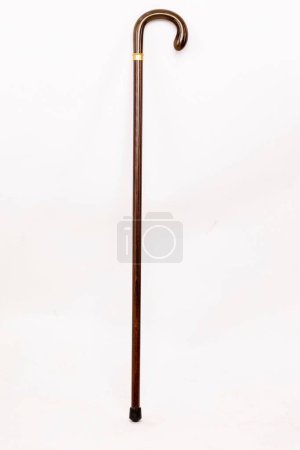 Photo for A vertical shot of a cherry acacia wooden walking stick cane with collar isolated on white background - Royalty Free Image